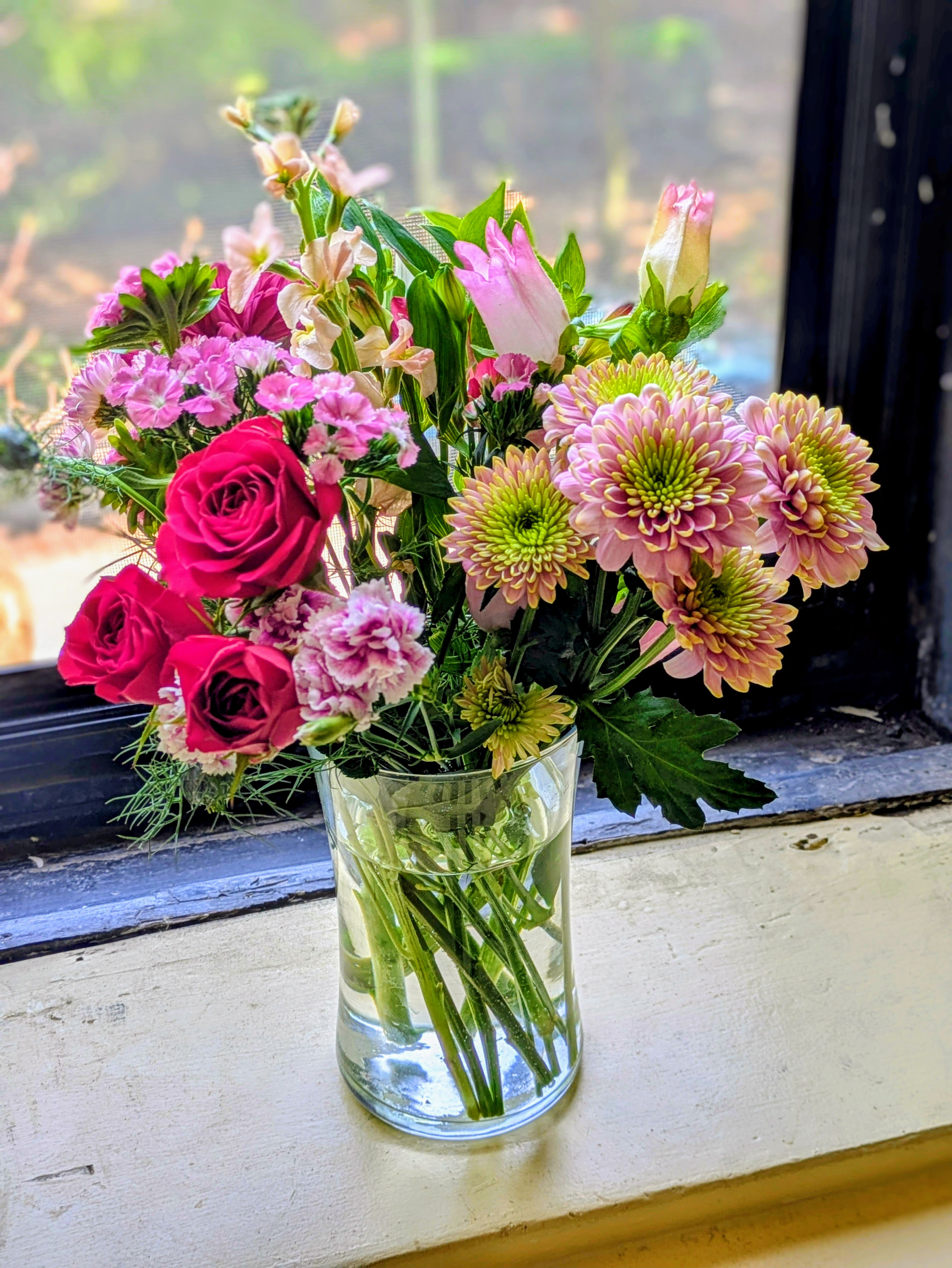 colorful bouquet of roses, mums, etc.